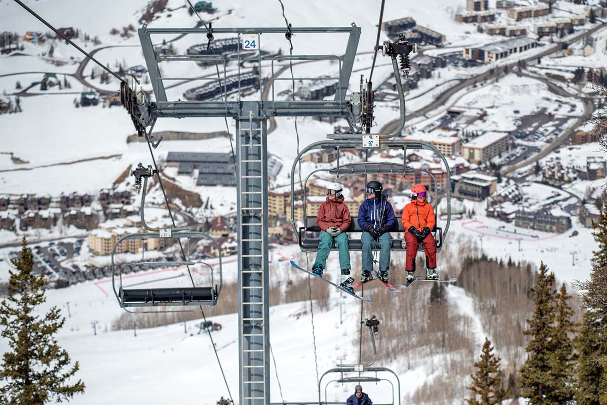 Riding chairlift above resort town